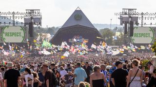 A crowd gathers at the Glastonbury festival Pyramid Stage